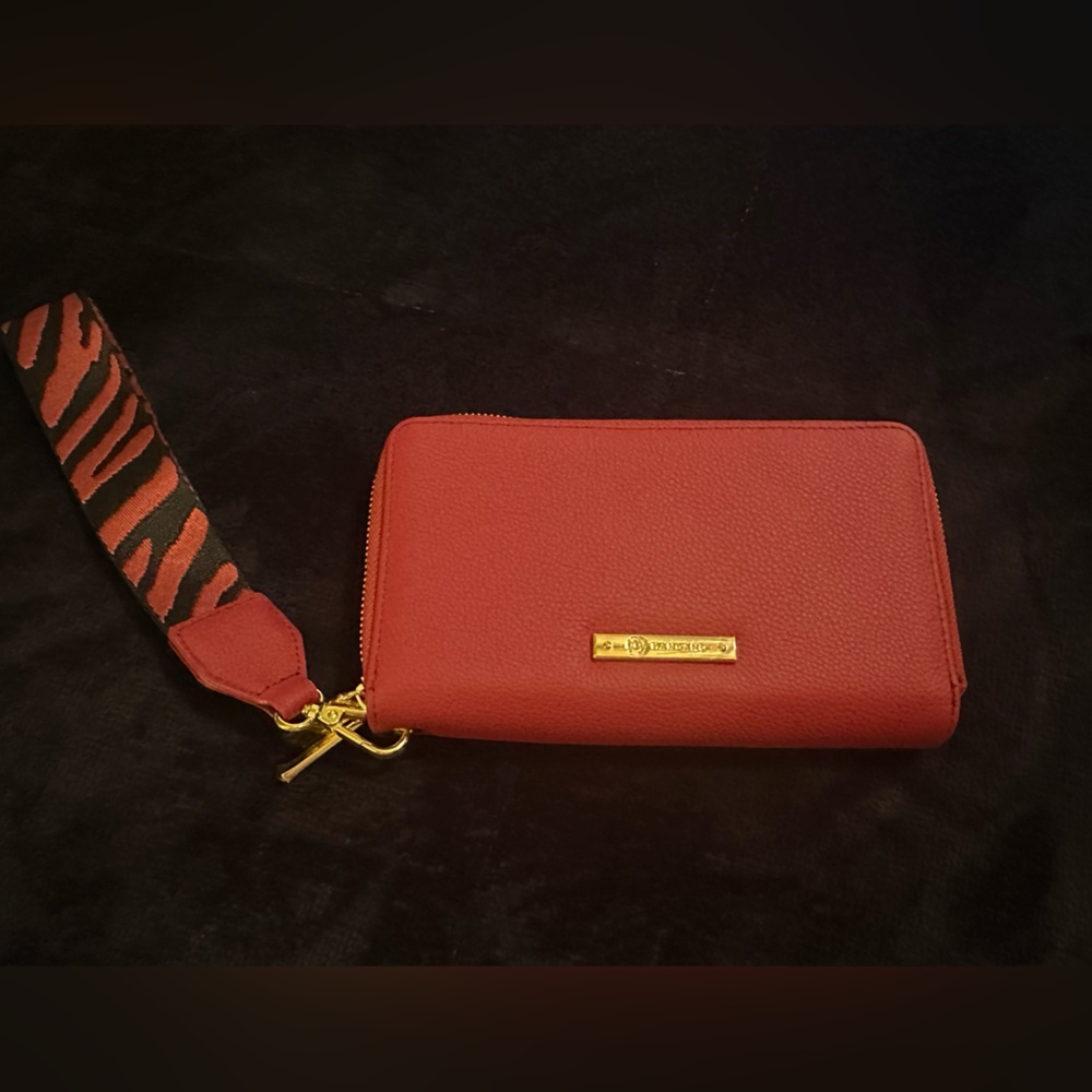 Clutch that holds a cell phone